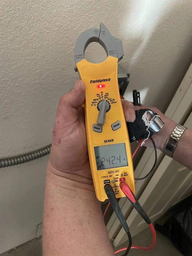 Voltage testing with clamp meter during Ceiling Fan Installation in Pemberton